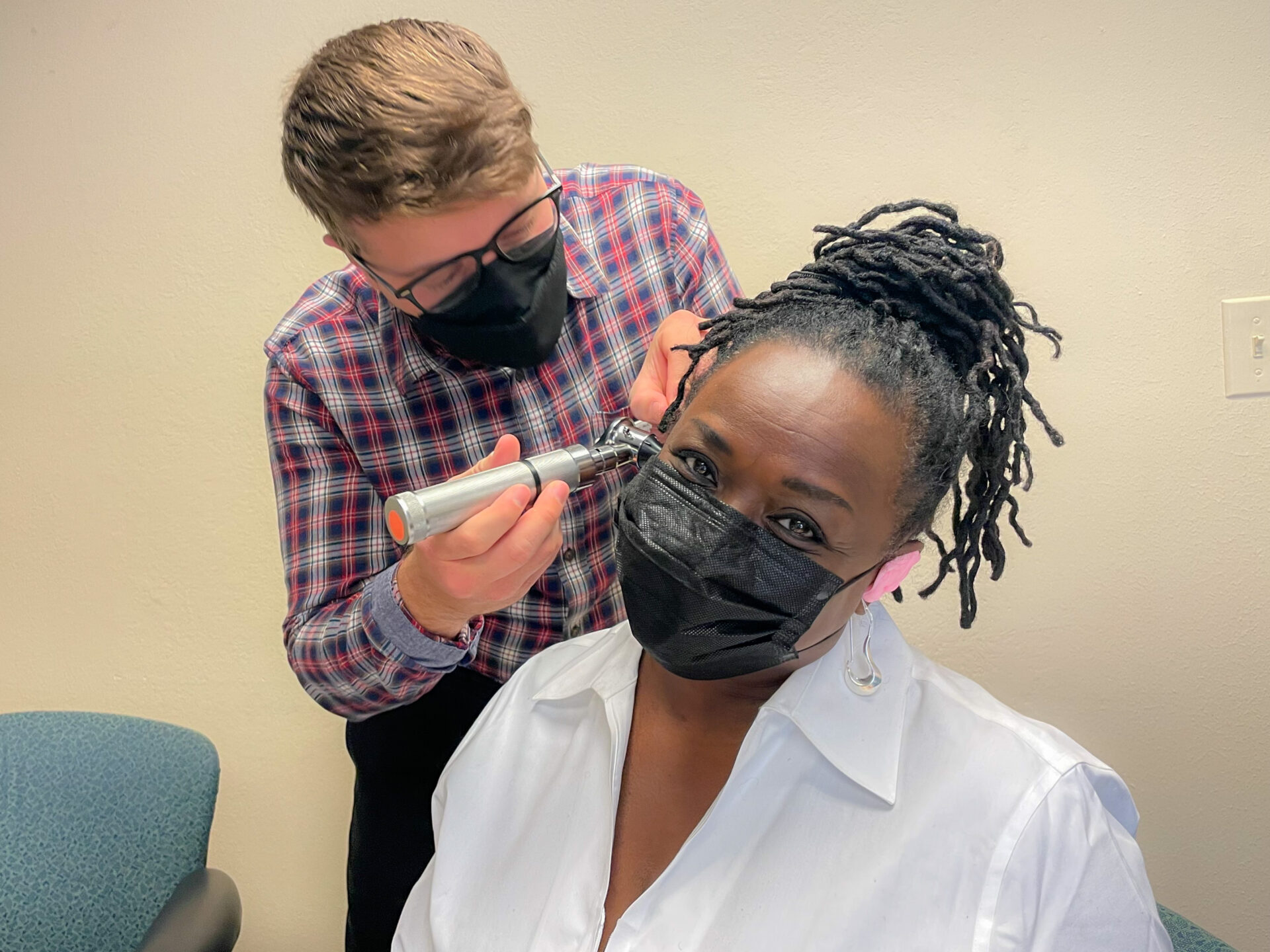 Doctor getting her temperature checked